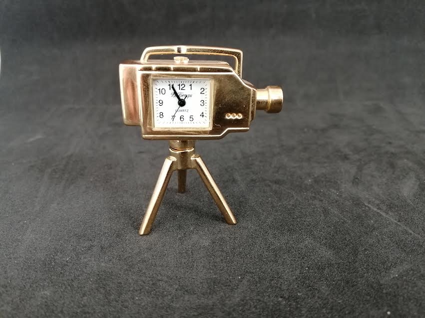Horloge quartz en forme de caméra, en métal doré